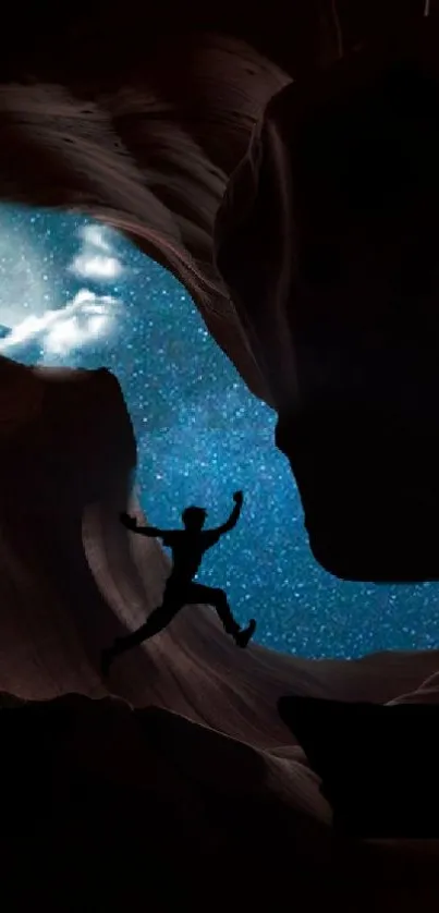 Silhouette jumping in a cave with a starry sky backdrop.