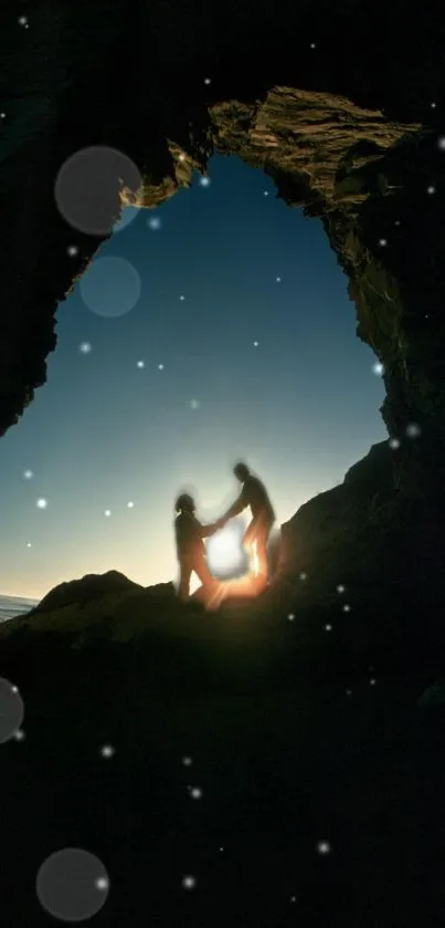 Silhouette of a couple in a rock archway at dusk, starlit night.