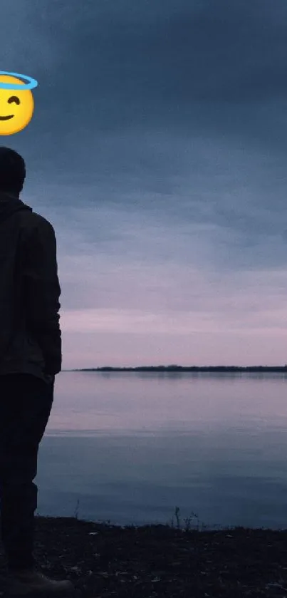 Silhouette against a lake at sunset under dark blue skies.