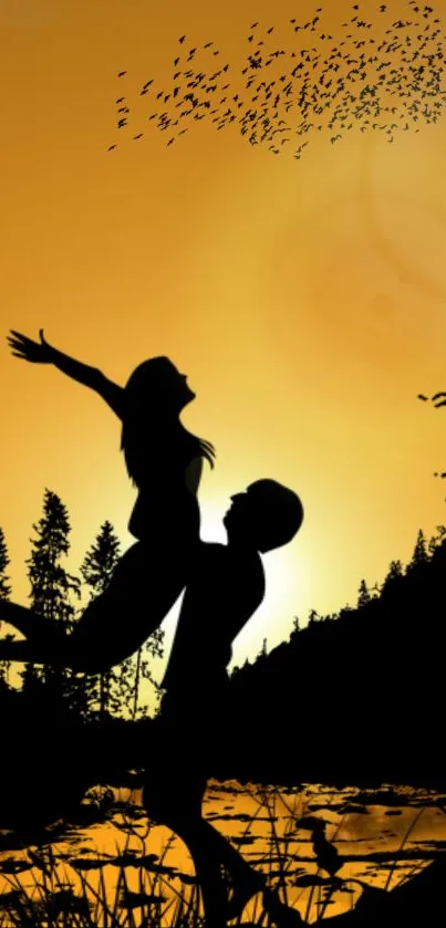 Romantic silhouette of a couple at sunset with birds in an orange landscape.