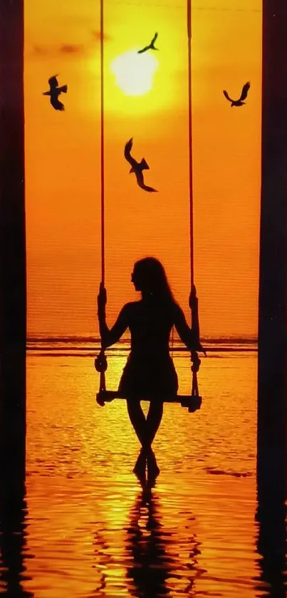 Silhouette on swing at sunset with birds flying, reflecting over calm water.