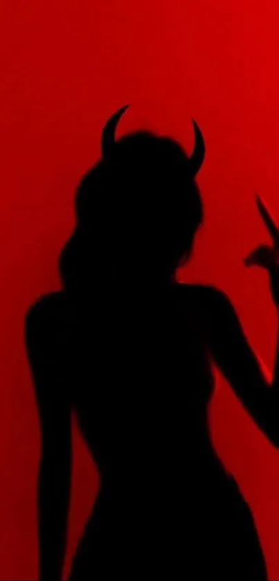 Silhouette with horns on vibrant red background.