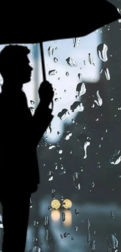 Silhouette with umbrella against rainy window.