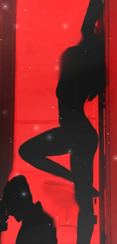 Silhouette art in red light mobile wallpaper.