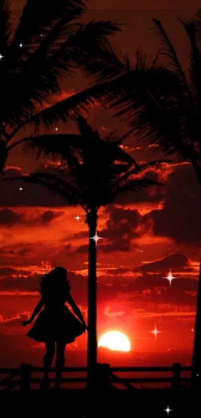 Silhouette of palm trees against a sunset sky.