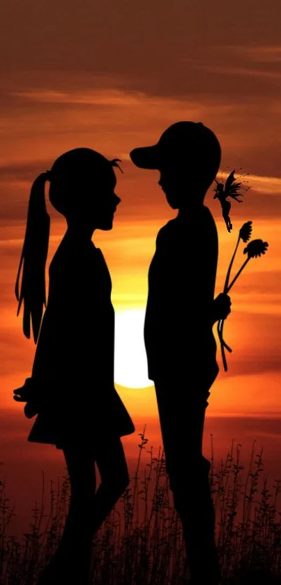 Silhouette of a boy and girl with a sunset background.