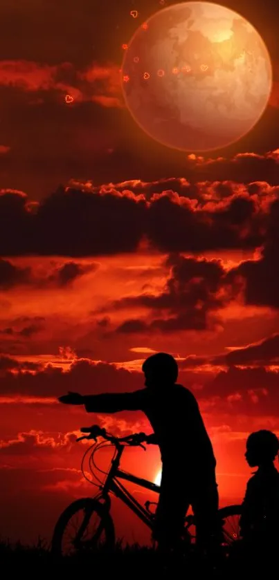 Silhouette of children with bicycle against a red sunset and glowing moon.