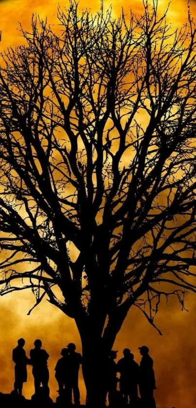 Tree silhouette under a golden moonlit sky.