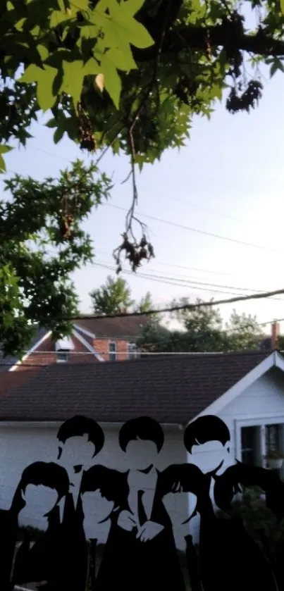 Silhouette of six people under leafy trees with a suburban house in the background.