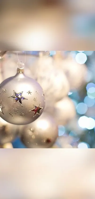 Elegant silver Christmas ornament with festive bokeh lights.