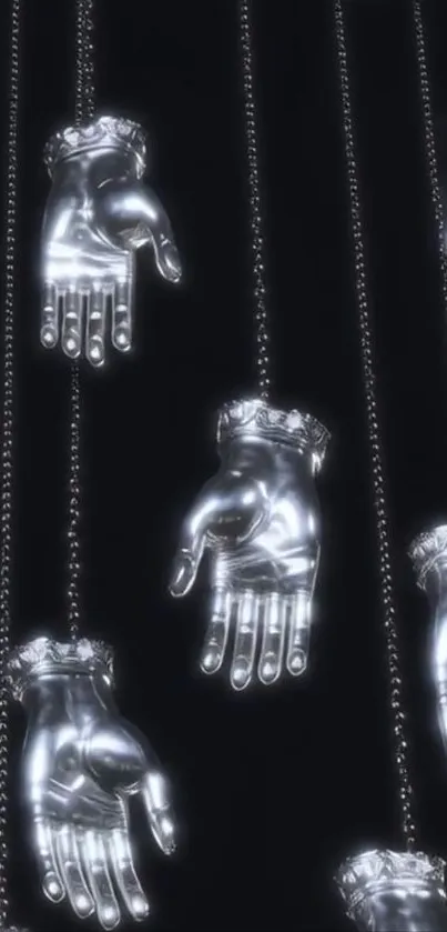 Silver hands hanging in striking design against a black background.
