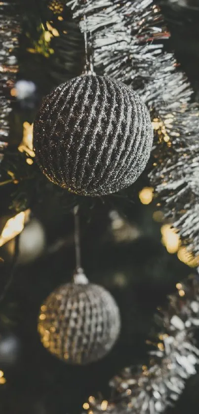 Silver holiday ornaments and tinsel decor in mobile wallpaper.