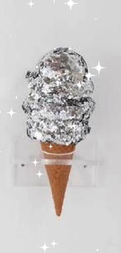 Artistic silver ice cream sculpture on a sleek white background.