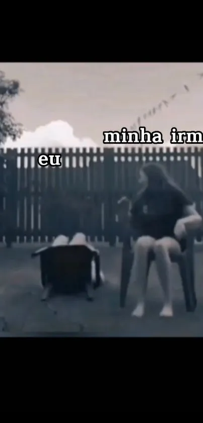 Humorous black and white scene with sisters enjoying outside.