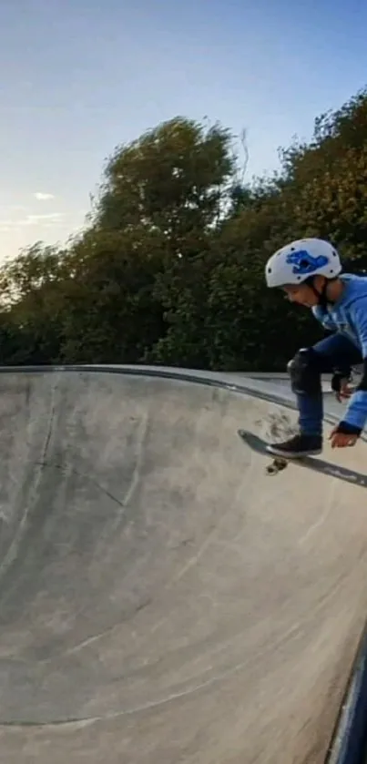 Young skateboarder at skate park ramp during sunset adventure.