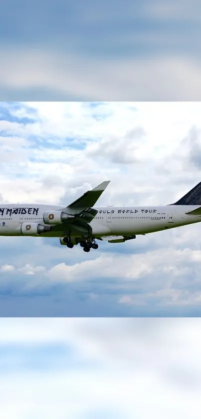 A large airplane flying through bright blue skies with clouds.