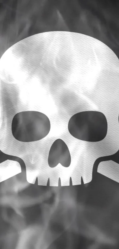 Monochrome skull and bones with smoke effects for phone wallpaper.