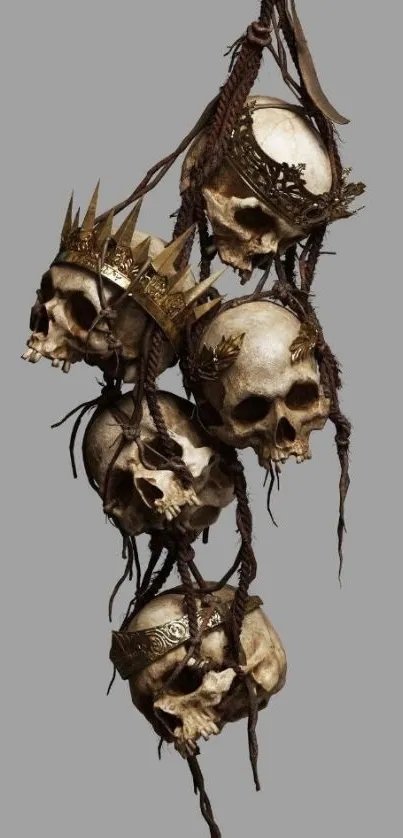 Artistic skulls with crowns on a gray background mobile wallpaper.