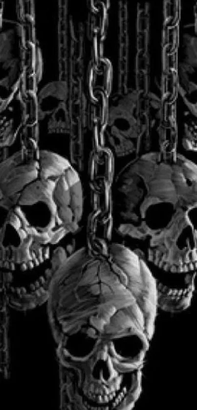 Dark wallpaper with skulls and chains in monochrome art style.