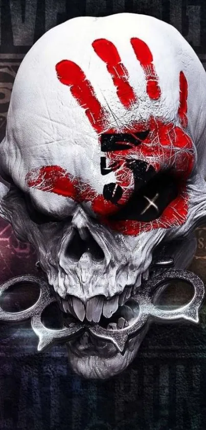 Skull with red handprint art on dark background.