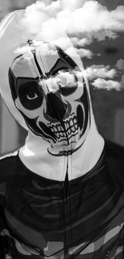 Person with a skull mask under clouded sky in black and white.