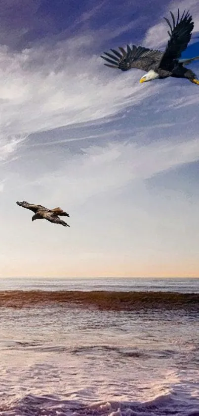 Eagles flying over the ocean with a dramatic blue sky backdrop.