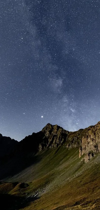 Breathtaking view of starry night sky over a mountain landscape.