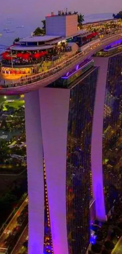 Marina Bay Sands illuminated with city lights at night.