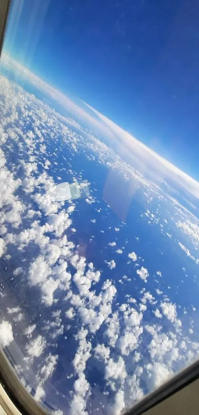 A stunning view of clouds and blue sky from an airplane window.