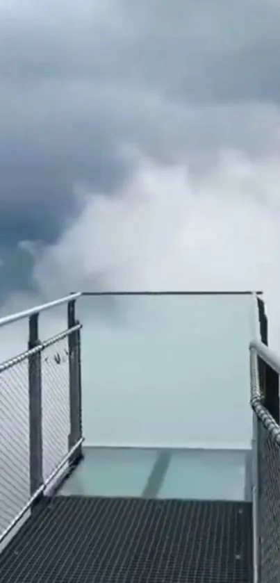 Skywalk platform above the clouds with a dramatic cloudy sky.