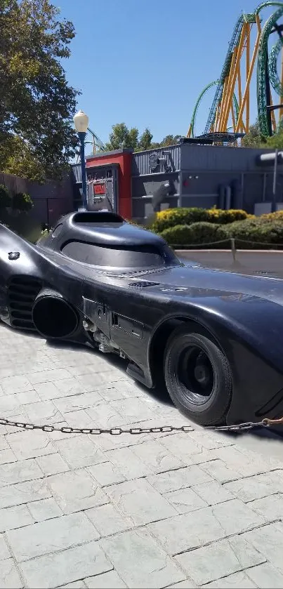 Sleek Batmobile parked in urban park