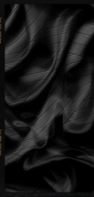 Sleek black abstract mobile wallpaper with elegant folds and textures.