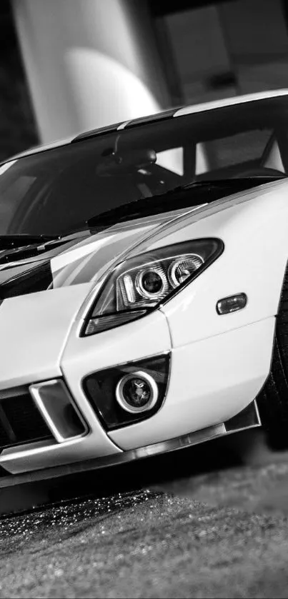 Sleek sports car wallpaper in black and white parked stylishly.