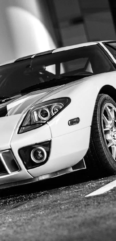 Black and white vintage sports car parked.