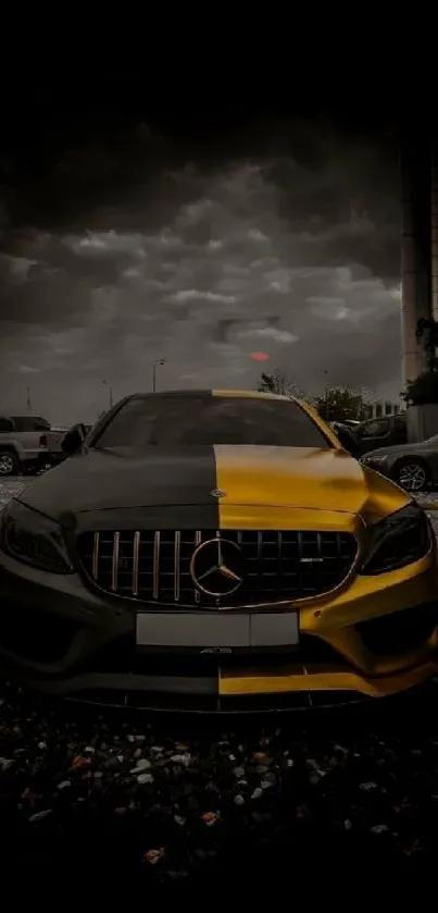 Black and yellow Mercedes car in cloudy backdrop.