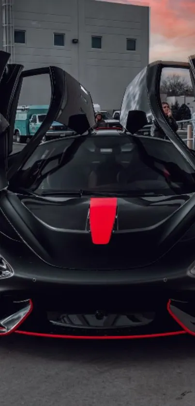 Black sports car with red accents at sunset