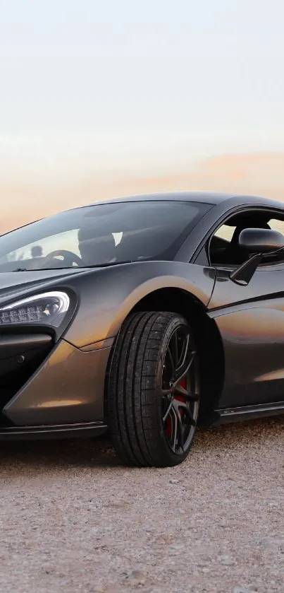 Sleek black sports car on an open road.