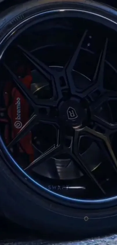 Close-up of a polished black car rim with intricate design.