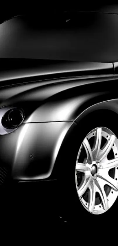 Sleek black car with stylish curves and elegant wheels.