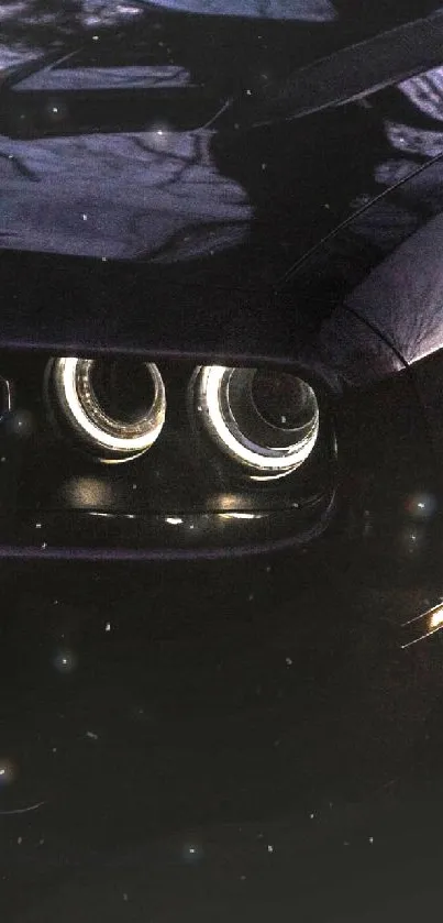 Sleek black car with glowing headlights at night in high-resolution mobile wallpaper.