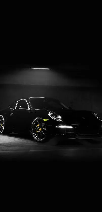 Sleek black sports car in dark setting wallpaper.