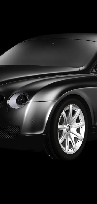 Sleek black sports car against a dark background.