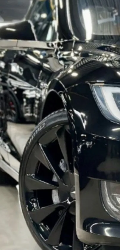 Sleek black car with glossy reflection.