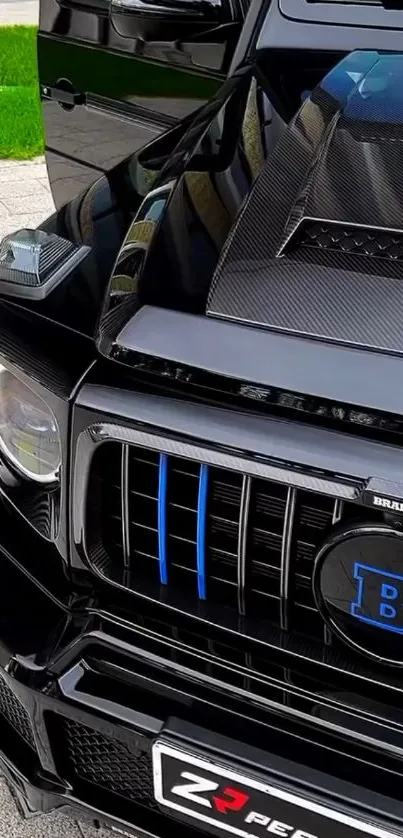 Black luxury SUV with carbon fiber accent and distinct detailing.