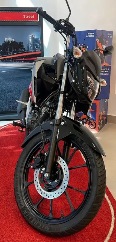 Sleek black motorcycle on showroom display, ideal for wallpaper enthusiasts.