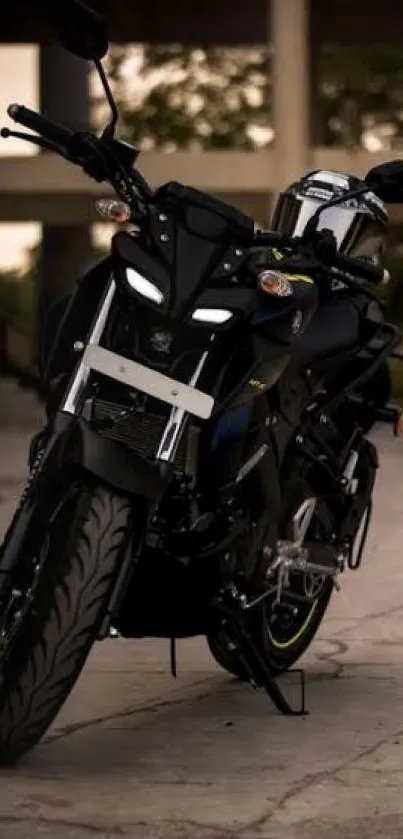 Sleek black motorcycle in dim light.