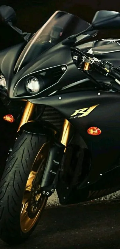 Sleek black motorcycle with golden accents on a dark background.