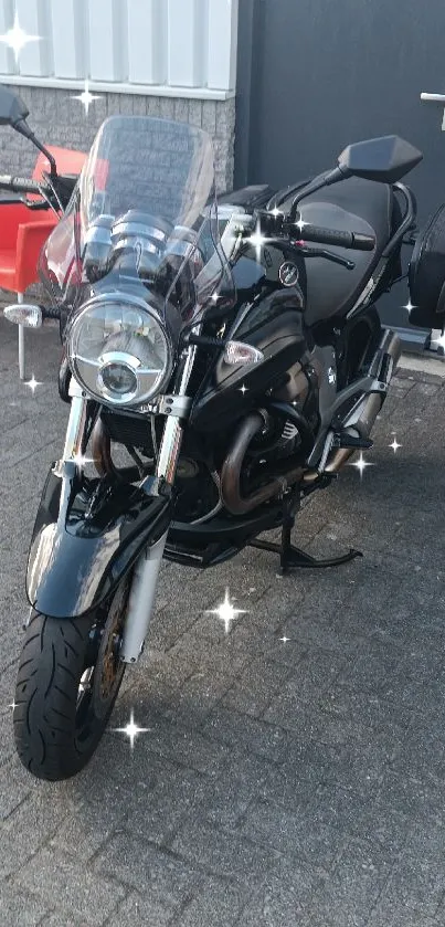 Sleek black motorcycle parked outside.