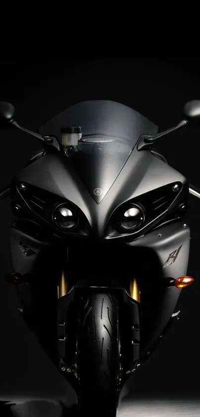 Sleek black motorcycle in dark background wallpaper.