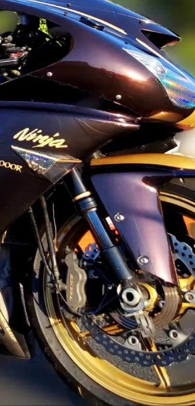 Black sports motorcycle with gold accents on a dynamic mobile wallpaper.